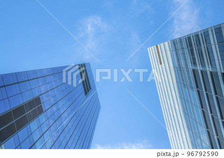 Glass buildings towering under the bright blue sky in downtown Austin Texas 96792590