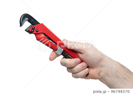 Close up of hand with iron red and black wrench isolated on white background with clipping path 96798370