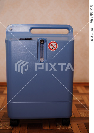 Oxygen concentrator. Oxygen generator. Medical equipment oxygen apparatus for breathing. Treatment of severe patients with impaired respiratory function Oxygen concentrator. Oxygen generator. Medical equipment oxygen apparatus for breathing. Treatment of severe patients with impaired respiratory function 96799919