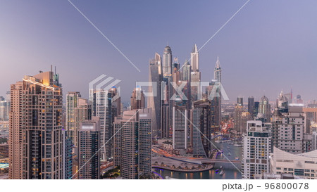 View of various skyscrapers in tallest recidential block in Dubai Marina aerial day to night timelapse View of various skyscrapers in tallest recidential block in Dubai Marina aerial day to night timelapse 96800078
