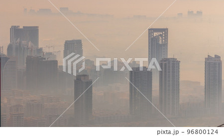 Dubai Aerial view showing fog over al barsha heights and greens district area timelapse 96800124