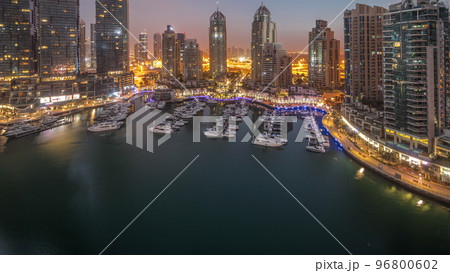Luxury yacht bay in the city aerial night to day timelapse in Dubai marina 96800602