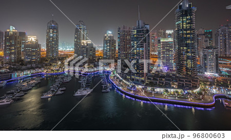 Panorama showing luxury yacht bay in the city aerial night timelapse in Dubai marina 96800603