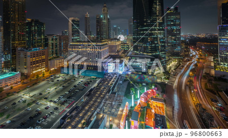 Panorama showing Dubai International Financial district aerial night timelapse. View of business and financial office towers. Panorama showing Dubai International Financial district aerial night timelapse. View of business and financial office towers. 96800663