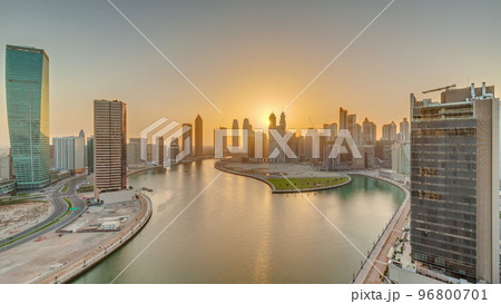 Sunset cityscape of skyscrapers in Dubai Business Bay with water canal aerial timelapse 96800701