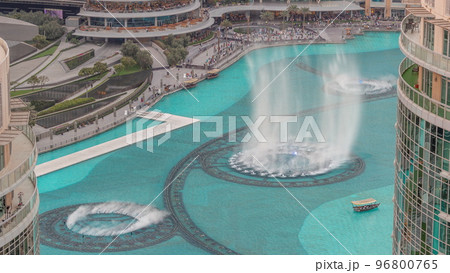 Dubai singing fountains with walking area around aerial view timelapse. Dubai singing fountains with walking area around aerial view timelapse. 96800765