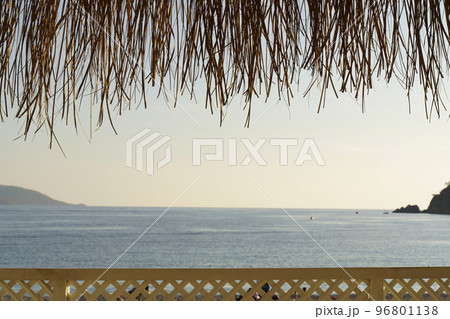 Beach cafe on sea sunset. Beautiful tropical evening on the coast. Relax, summer, vacation. Beach cafe on sea sunset. Beautiful tropical evening on the coast. Relax, summer, vacation. 96801138