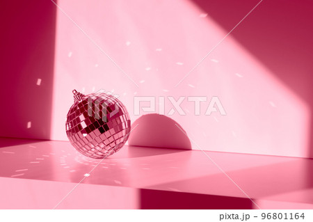 Magenta Disco ball in sunlight on white background 96801164