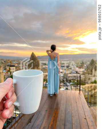 Young woman in dress on the roof with amazing view of Cappadocia in Turkey 96803762