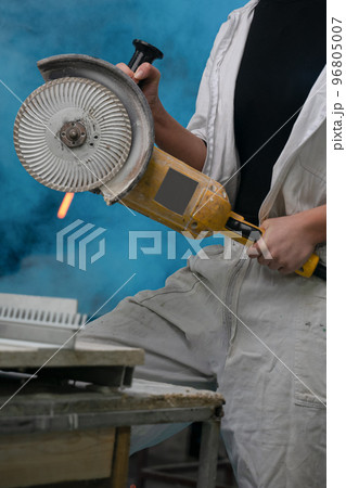 girl working in manufacturing industry job using industrial power tool - Maintenance, production and career concept. worker with angle grinder close-up . feminism. plant, factory girl working in manufacturing industry job using industrial power tool - Maintenance, production and career concept. worker with angle grinder close-up . feminism. plant, factory 96805007