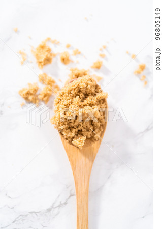 Light brown sugar on a marble counter top. Light brown sugar on a marble counter top. 96805149