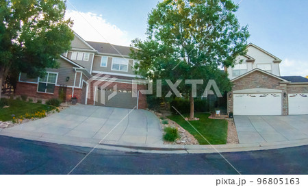 View of the typical suburban neighborhood on a summer morning. 96805163