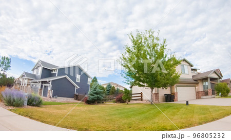 View of the typical suburban neighborhood on a summer morning. 96805232