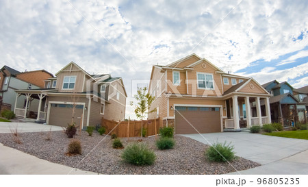 View of the typical suburban neighborhood on a summer morning. 96805235