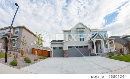 View of the typical suburban neighborhood on a summer morning. 96805244