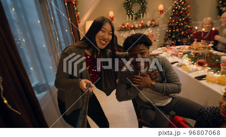 Asian woman records video with family on Christmas Asian woman records video with family on Christmas 96807068