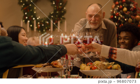 Family raising wineglasses celebrating Christmas 96807073