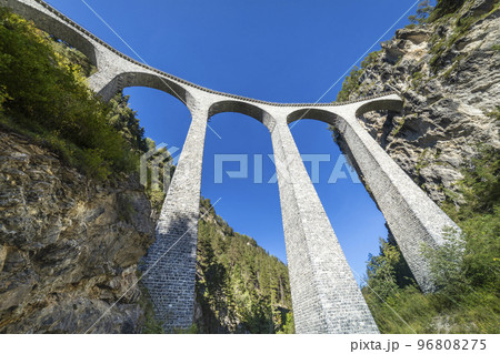 Swiss train over Landwasser Viaduct bridge in the alps, Graubunden, Switzerland Swiss train over Landwasser Viaduct bridge in the alps, Graubunden, Switzerland 96808275