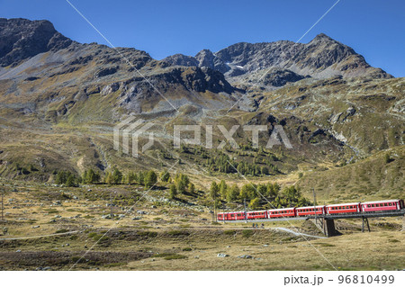 Swiss train in the alps mountains around Bernina pass, Engadine, Switzerland 96810499