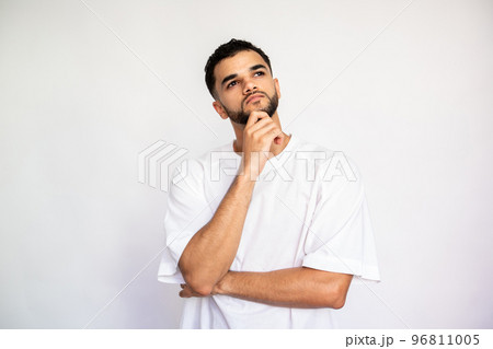 Portrait of thoughtful young man leaning on hand 96811005
