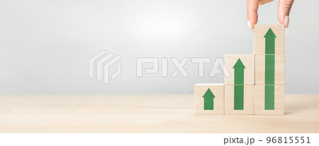 Growth or increase concept. Cube block staircase moving step growing up. Success achievement or goal business motivation. Hand putting wooden block on top. wide banner. copy space 96815551