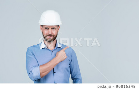 confident guy pointing finger on copy space. business project engineer. successful male ceo. 96816348