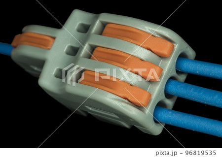 Compact splicing connector isolated on black background. 96819535