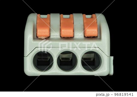 Compact splicing connector isolated on black background. 96819541