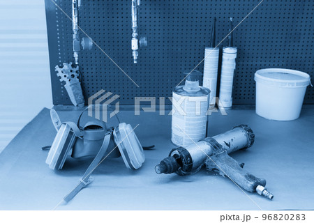 airbrush for car painting, spray gun in auto repair shop 96820283