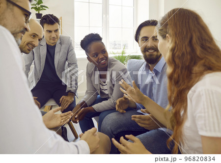 Group of happy multiracial coworkers and friends sharing and discussing work news 96820834