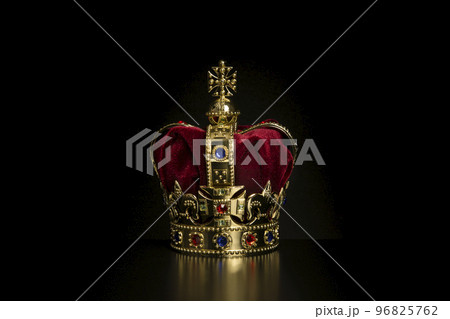 Golden crown on a black background with copy space 96825762