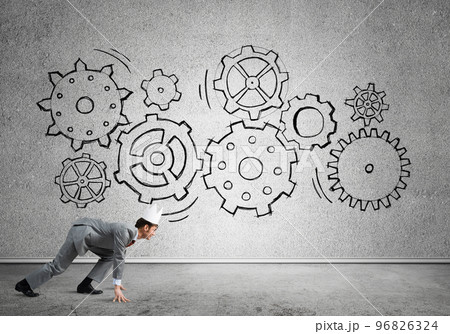 King businessman in elegant suit running in empty room with wooden floor 96826324