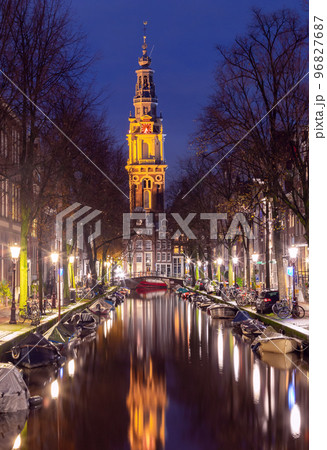 Beautiful old houses on the city waterfront of Amsterdam at sunset. 96827687