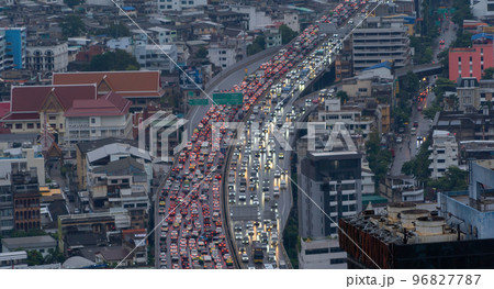 Aerial view of busy cars with traffic jam in the rush hour on highway road street on bridge in Bangkok Downtown, urban city in Asia, Thailand at sunset. Intersection junction. Toll gate in Rama 9 Aerial view of busy cars with traffic jam in the rush hour on highway road street on bridge in Bangkok Downtown, urban city in Asia, Thailand at sunset. Intersection junction. Toll gate in Rama 9 96827787