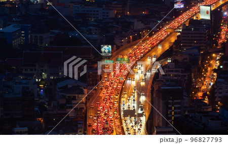 Aerial view of busy cars with traffic jam in the rush hour on highway road street on bridge in Bangkok Downtown, urban city in Asia, Thailand at sunset. Intersection junction. Toll gate in Rama 9 Aerial view of busy cars with traffic jam in the rush hour on highway road street on bridge in Bangkok Downtown, urban city in Asia, Thailand at sunset. Intersection junction. Toll gate in Rama 9 96827793
