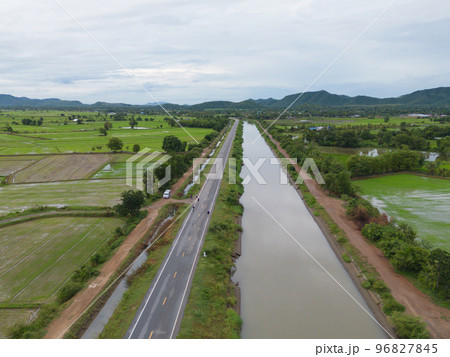 Aerial top view of road or street on mountain hill with green natural forest trees in rural area of Thailand. Transportation. Aerial top view of road or street on mountain hill with green natural forest trees in rural area of Thailand. Transportation. 96827845