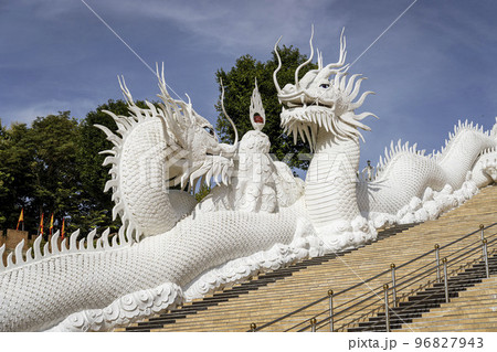 The Temple of Mercy (Guanyin) in Chiang Rai, Thailand sits on top of a mountain is entirely white 96827943