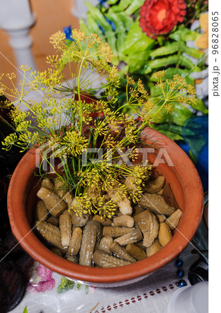 Marinated cucumbers, garlic and dill on a plate 96828065
