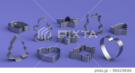 Set of metal cookie cutters for homemade Christmas biscuit on a violet 96829686