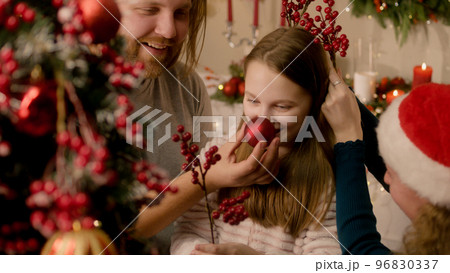 Happy caucasian family decorating Christmas tree 96830337