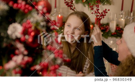 Happy caucasian family decorating Christmas tree Happy caucasian family decorating Christmas tree 96830349
