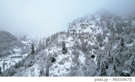 Cable car in the mountains in the winter forest Cable car in the mountains in the winter forest 96830678