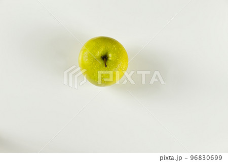 top view of green apple with drops on white background top view of green apple with drops on white background 96830699