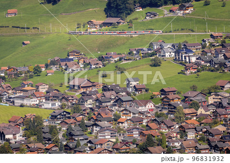 Red Train and lungern village in the Swiss Alps, Switzerland 96831932