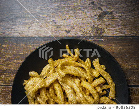 pork rind in black plate on wood table for food concept pork rind in black plate on wood table for food concept 96836308
