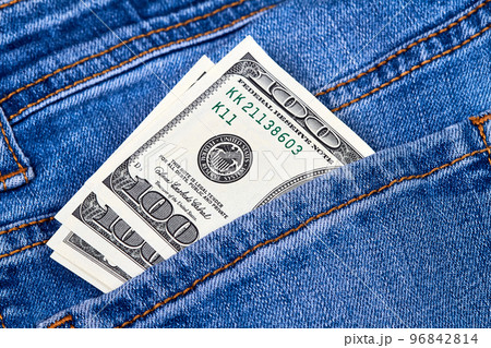 Hundred dollar bills in jeans pocket Hundred dollar bills in jeans pocket 96842814