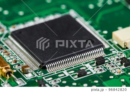 Close-up of computer chip on a part of electronic printed circuit board 96842820