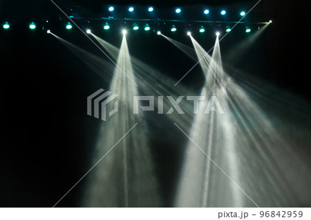 Blue and white concert stage scene show party lights on black dark background Blue and white concert stage scene show party lights on black dark background 96842959