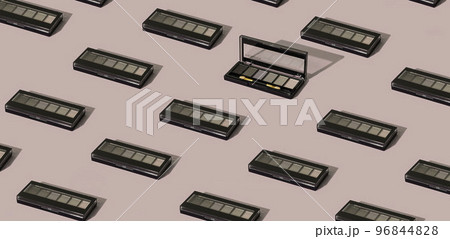 Fashionable isometric pattern with a palette of eye shadow on a pastel nude background Fashionable isometric pattern with a palette of eye shadow on a pastel nude background 96844828