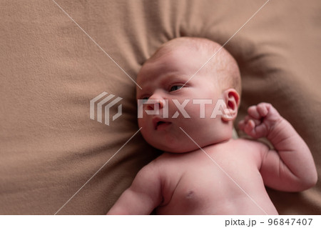 Baby boy posing for his first portrait Baby boy posing for his first portrait 96847407